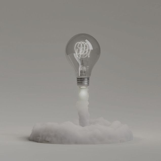 A light bulb emitting light, surrounded by a soft cloud of white material.
